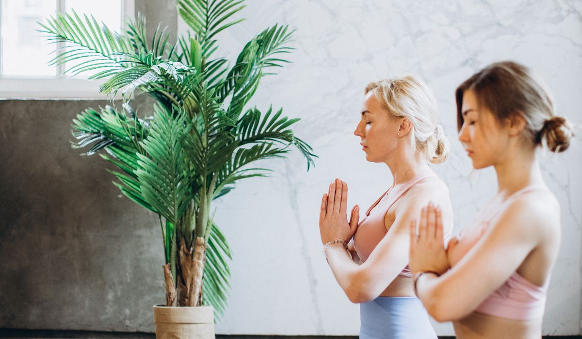 Woman practicing yoga outdoors